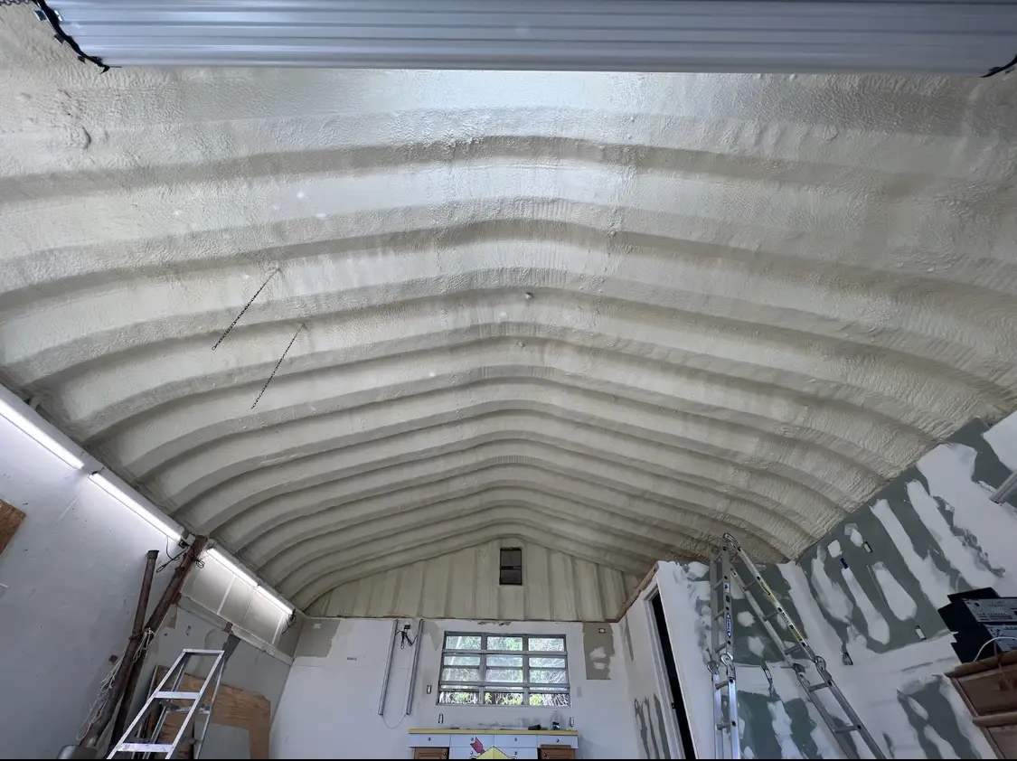 Spray polyurethane foam applied to the underside of a metal roof deck in Montrose-Ghent